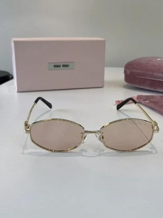Miu Miu Cat-Eye Sunglasses with Gold Frames and Pink Lenses - Picture 4 of 7